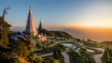 Twin pagoda built on top of the mountain in the North of Thailand during sunset scene.