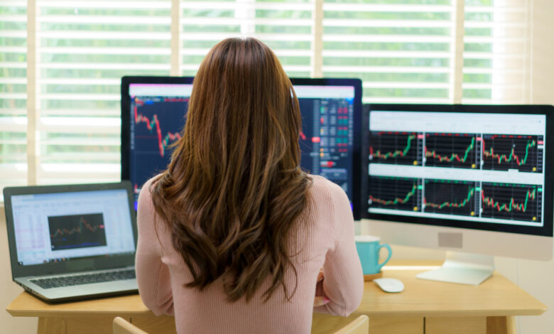 Happy Asian woman gleefully examines a promising stock graph. Her confident gaze reflects the satisfaction of making informed financial decisions, embodying the spirit of astute investment and financial empowerment